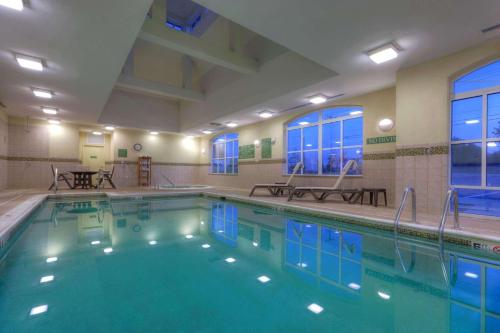 a large swimming pool in a hotel room at Country Inn & Suites by Radisson, Fredericksburg, VA in Fredericksburg