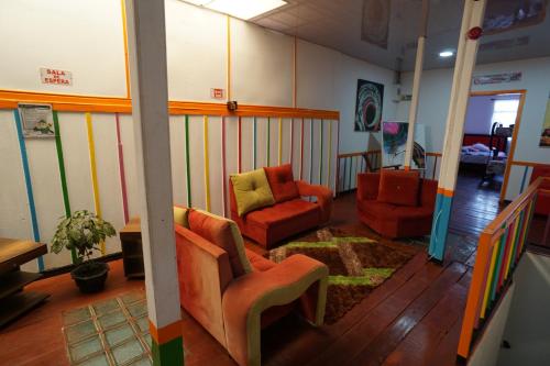 a living room with two chairs and a couch at Hotel Arte Santa Rosa in Santa Rosa de Cabal
