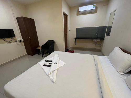 TV o dispositivi per l'intrattenimento presso Kaippillil apart hotel