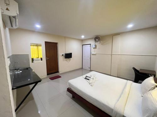 Letto o letti in una camera di Kaippillil apart hotel