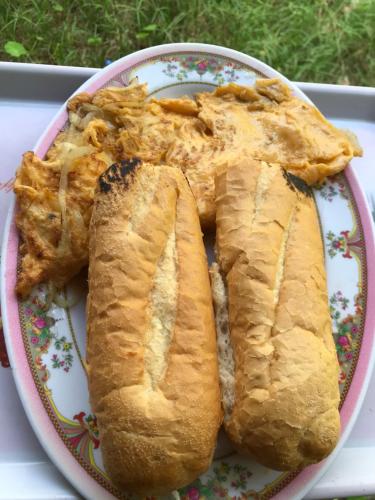 a plate with two slices of bread on it at Naks Shack in Koh Ta kiev Island