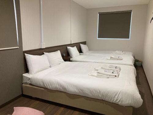 Katil atau katil-katil dalam bilik di RJ HOTELS OTARU