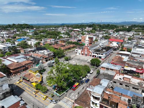 an overhead view of a city with buildings and a street at Hotel Sandiego in Puerto Berrío