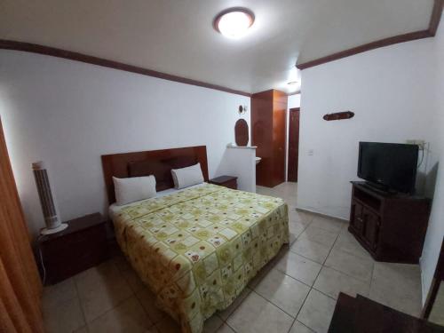 Postel nebo postele na pokoji v ubytování Hotel Estación Guadalajara