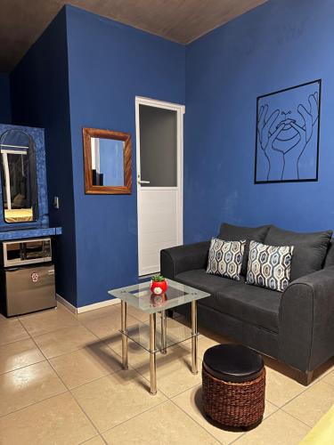 a living room with a couch and a table at Brisa del Mar #2 in Brisas de Zicatela