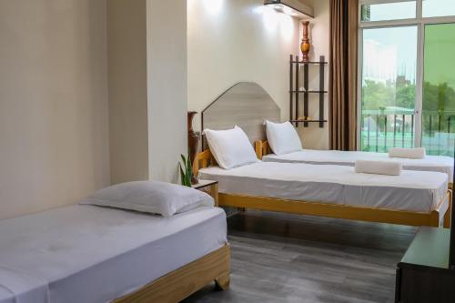 Кровать или кровати в номере Green Vista Maafushi