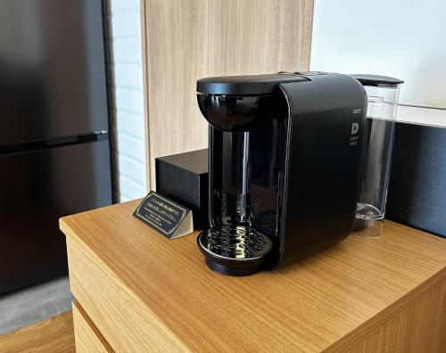 a coffee maker sitting on top of a counter at Hotel Dios - Vacation STAY 40406v in Awaji