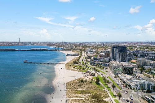 a city with a beach and the ocean and buildings at Stylish Studio close to City in Melbourne