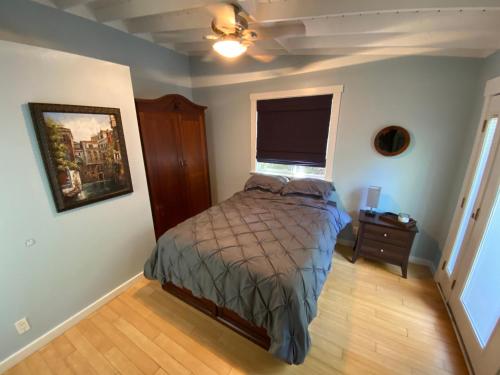 a small bedroom with a bed and a window at Malibu Ranch Guest House Hideway in Malibu