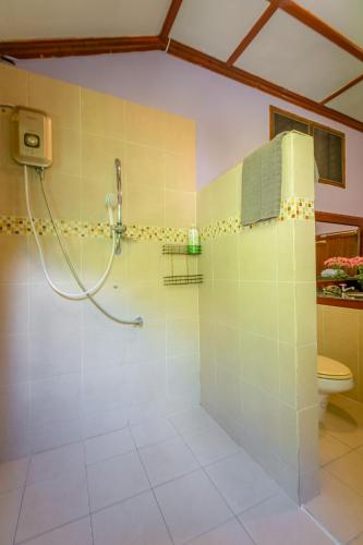 a bathroom with a shower and a toilet at Penthouse Crystal Bay Apartments in Ban Lamai