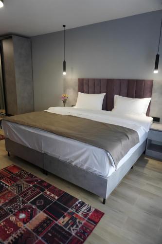 Giường trong phòng chung tại Dami Astana Hotel
