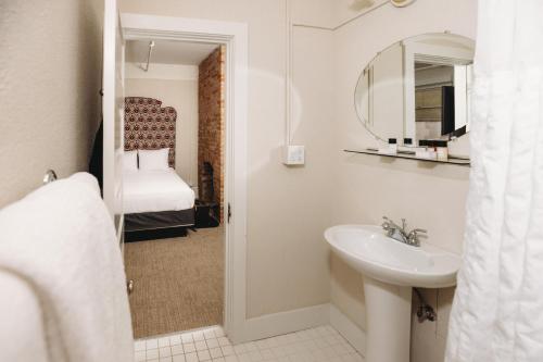 a bathroom with a sink and a mirror at Hotel Colorado in Glenwood Springs