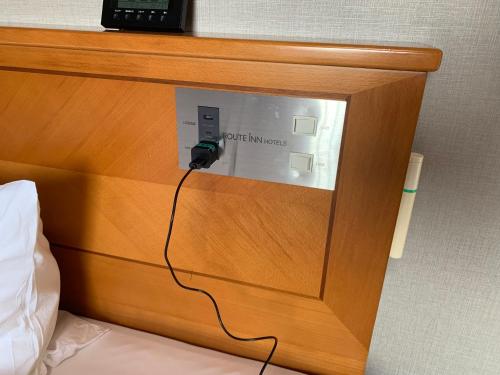 Postel nebo postele na pokoji v ubytování Hotel Route-Inn Nakatsu Ekimae