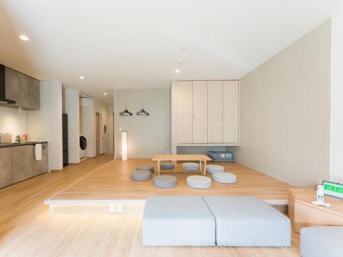a living room with a table and a couch at Rakuten STAY Nikko Hoden in Nikko