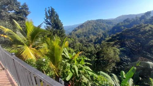 a view of the mountains from the balcony of a house at LD RoomA DunhidA in Badulla