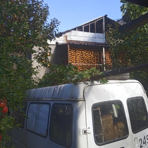 a white van with a house on top of it at Мргануш in Meghri