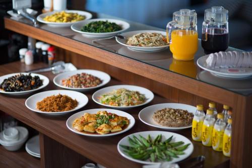 a buffet with plates of food on a table at sunlight mound in Yuanshan