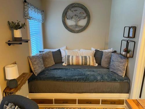 a couch in the corner of a living room at On Top Of Everything at Beech in Beech Mountain
