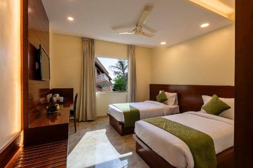מיטה או מיטות בחדר ב-Five Elements Hotels Mertiya Residency