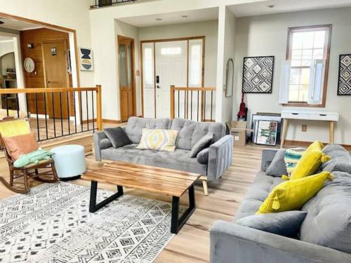 a living room with a couch and a coffee table at Waterfront house near the Niagara Falls/Canal/Canadian Border in Tonawanda