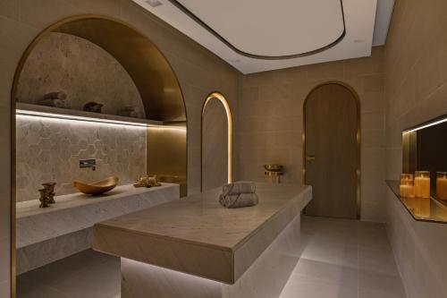 a bathroom with a large sink and a counter at Palace Dubai Creek Harbour in Dubai