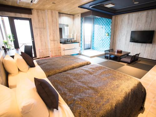 TV a/nebo společenská místnost v ubytování LiVEMAX RESORT Kyotango Sea Front