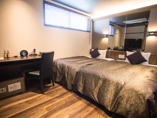 Postel nebo postele na pokoji v ubytování LiVEMAX RESORT Kyotango Sea Front