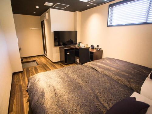 Postel nebo postele na pokoji v ubytování LiVEMAX RESORT Kyotango Sea Front