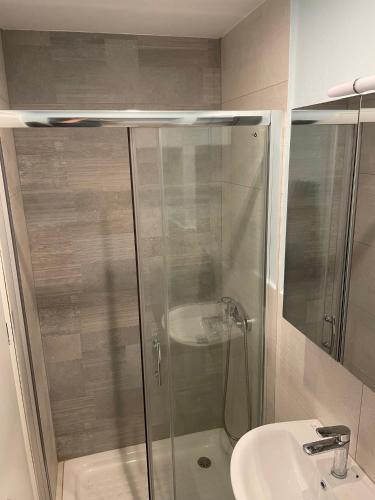 a bathroom with a shower and a sink at Filipa Apartment in Limenas