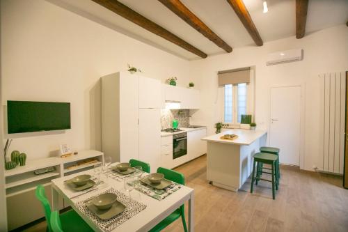 a kitchen and living room with a table and chairs at NonSoloValle in Chiaravalle