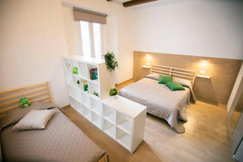 a bedroom with a bed and a dresser in it at NonSoloValle in Chiaravalle