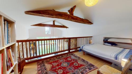 Ένα ή περισσότερα κρεβάτια σε δωμάτιο στο La Grange des Fragons