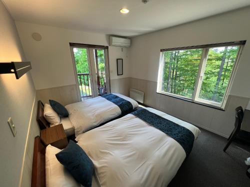 Postel nebo postele na pokoji v ubytování Chalet Fuyuri
