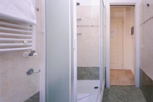 a bathroom with a shower and a walk in shower at Casa San Giuseppe in Rome