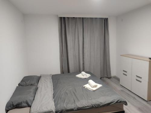 Un ou plusieurs lits dans un hébergement de l'établissement Apartmani Hub
