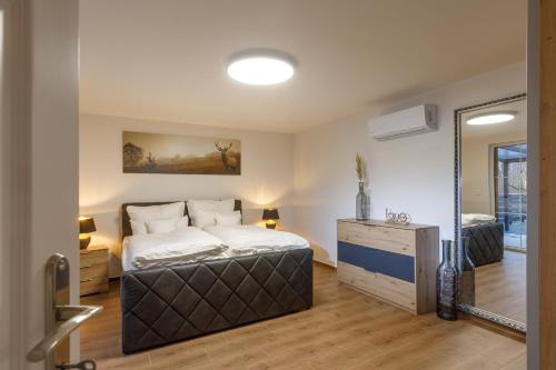 Voodi või voodid majutusasutuse Ferienhaus am Wald toas