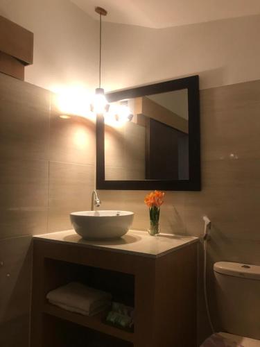 a bathroom with a sink and a mirror at ZiFa Mandalika in Kuta Lombok