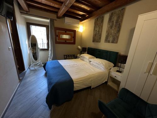 a bedroom with a bed and a television in it at Al Cardinale in Viterbo