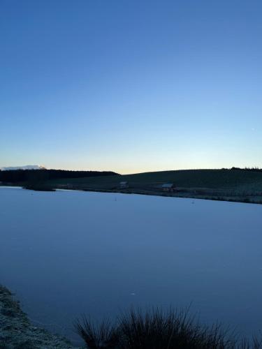 a view of a body of water at East Learmouth Lakeside Lodges - Larch Lodge in Cornhill-on-tweed
