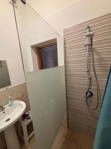 a bathroom with a shower and a sink at Gli Agrumi Rooms in Trapani
