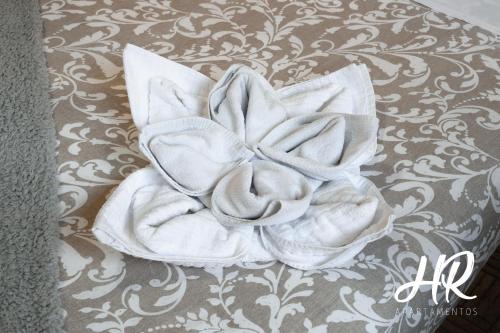 a white towel sitting on top of a bed at HR-Madrid-Puerta del Sol in Madrid
