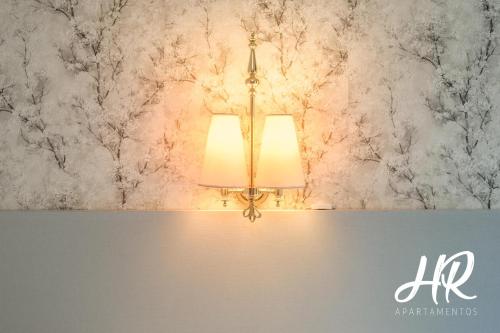 a lamp in a room with a wall at HR-Madrid-Puerta del Sol in Madrid