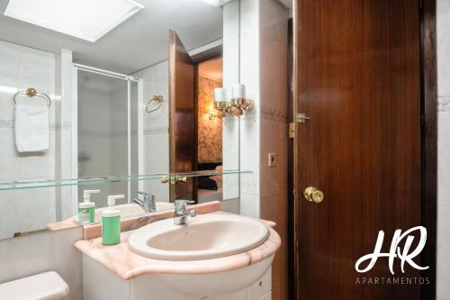 a bathroom with a sink and a toilet at HR-Madrid-Puerta del Sol in Madrid