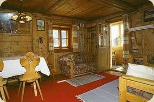 a living room with a bed and a couch at Cad Maté 2 in Maloja