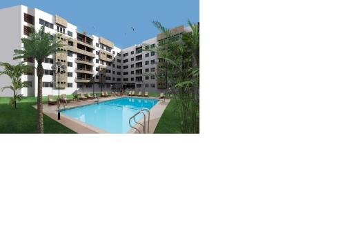une image d'un complexe d'appartements avec une piscine dans l'établissement Nouaceur Garden Airport Casablanca, à Nouaseur