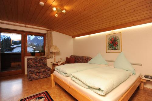 Ένα ή περισσότερα κρεβάτια σε δωμάτιο στο Haus Moosbrugger