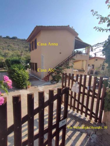a house with a fence in front of it at Anna e Ale - mare e relax in Costa Rei