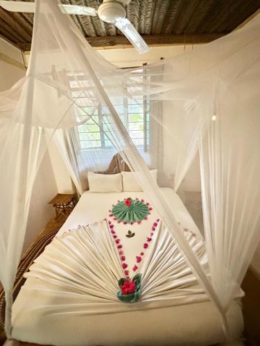 Letto o letti in una camera di HEBE Bungalows Lodge