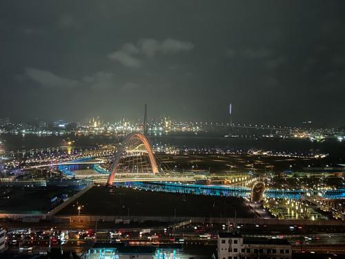 a view of a city at night with a roller coaster at Toyoko Inn Busan Station No.1 in Busan