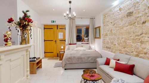a living room with a bed and a couch at Apartment Michaela 4-Sterne & Parking in Rovinj